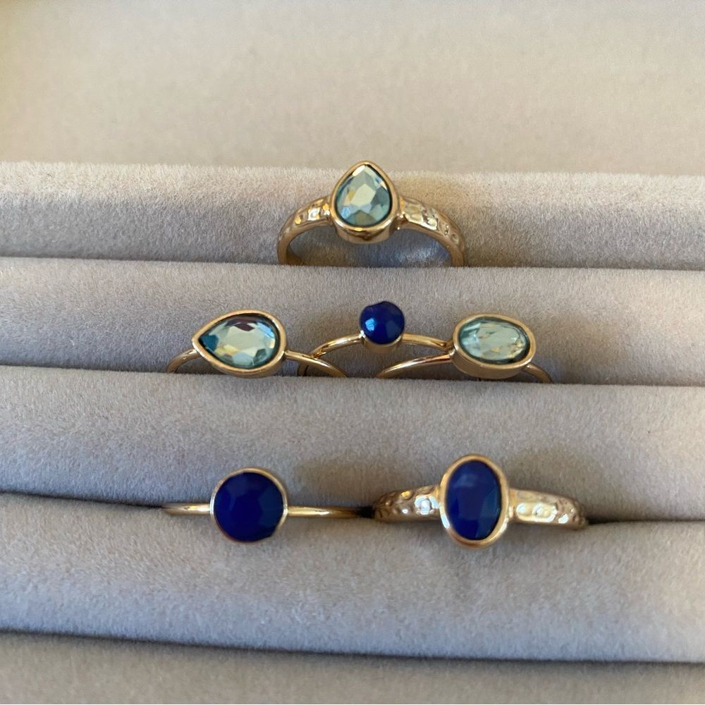 Set of 6 Thin Gold Toned Faux Gemstone Rings. 3 are Dark Blue & 3 are Lt. Blue